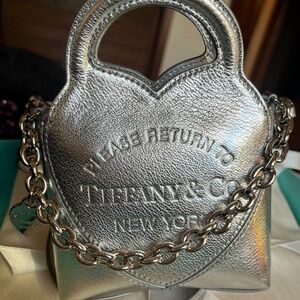 Rare, discontinued brand new never used micro tiffany tote in silver